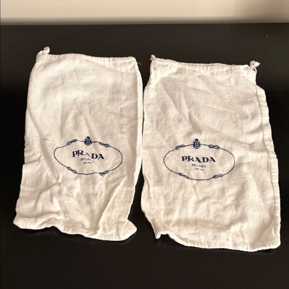 Two Prada dust bags